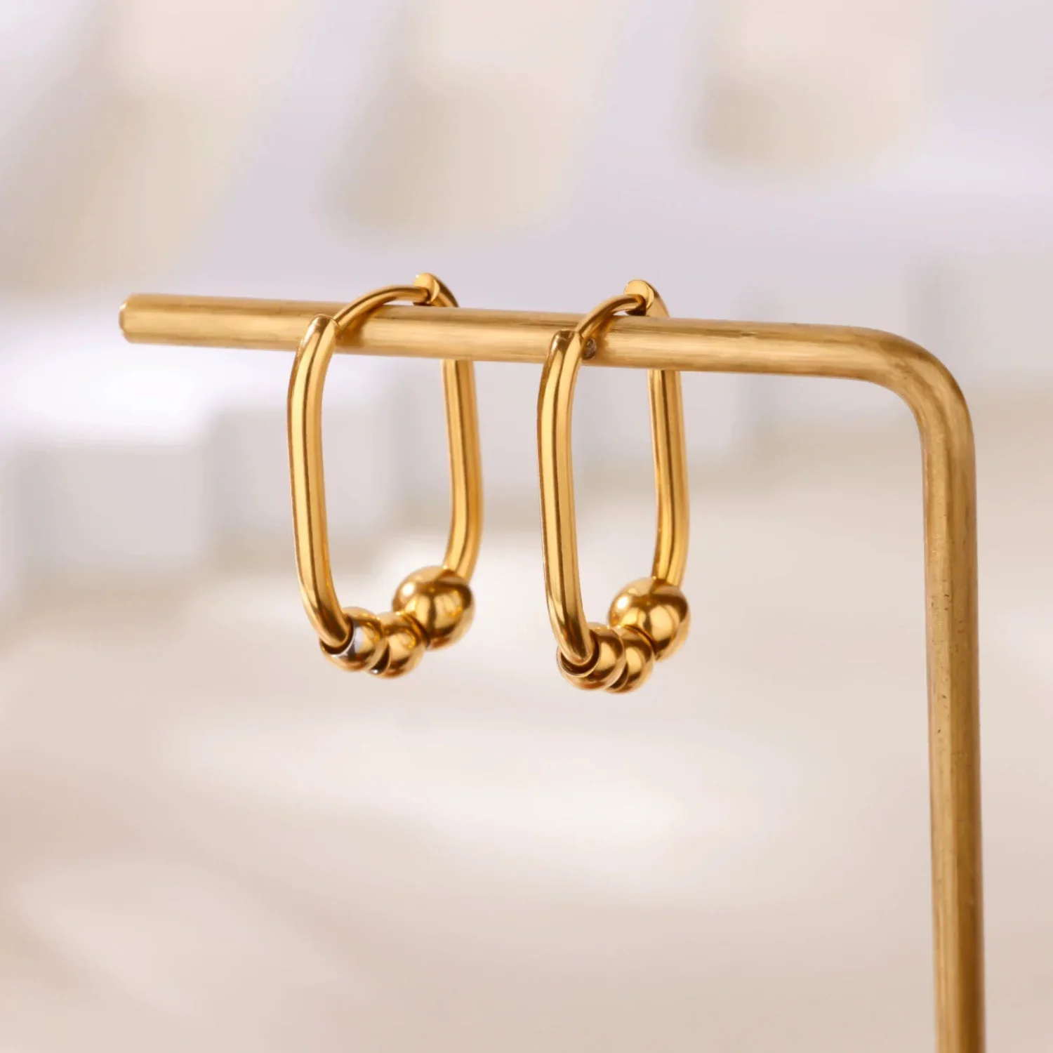Gold Oval Beaded Huggie Earrings - Image 2