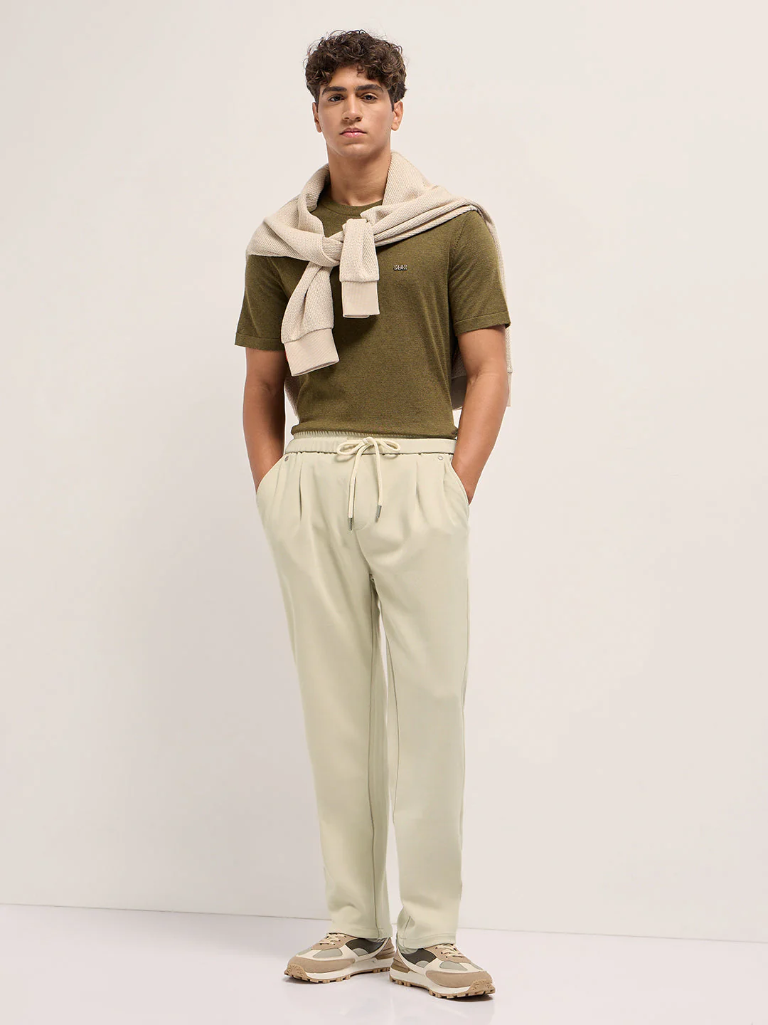Men Cream Solid Regular Fit Casual Trousers - Image 4